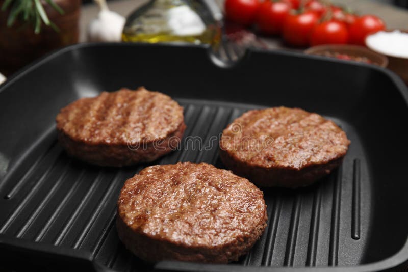 Tasty Fried Hamburger Patties on Grill Pan, Closeup Stock Photo Image