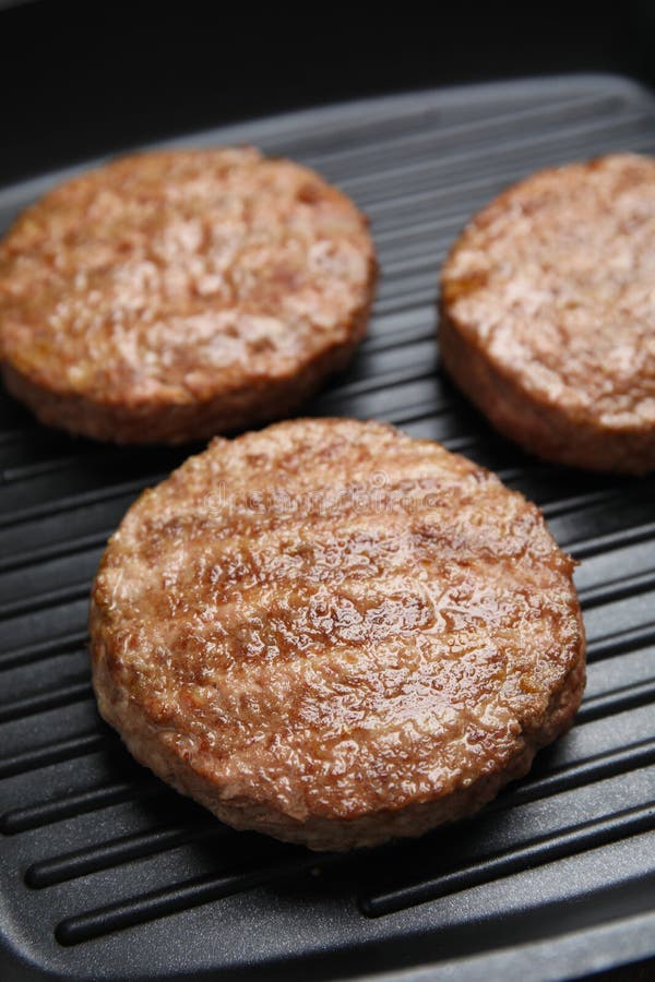 Tasty Fried Hamburger Patties on Grill Pan, Closeup Stock Photo Image