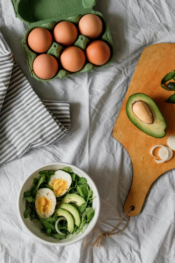 Tasty and Healthy Breakfast. Greens with Avocado and Eggs. Beautiful