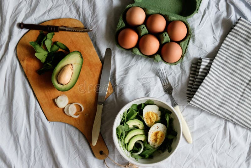 Tasty and Healthy Breakfast. Greens with Avocado and Eggs. Beautiful