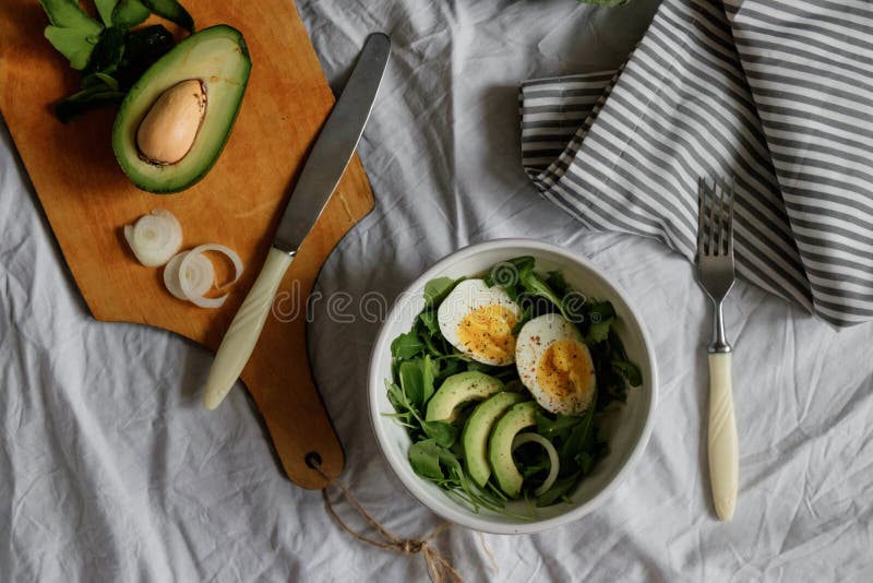 Tasty and Healthy Breakfast. Greens with Avocado and Eggs. Beautiful