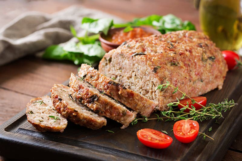 Tasty homemade ground baked turkey meatloaf on wooden table. royalty free stock photos Tasty homemade ground baked turkey meatloaf on wooden table. royalty free stock photos