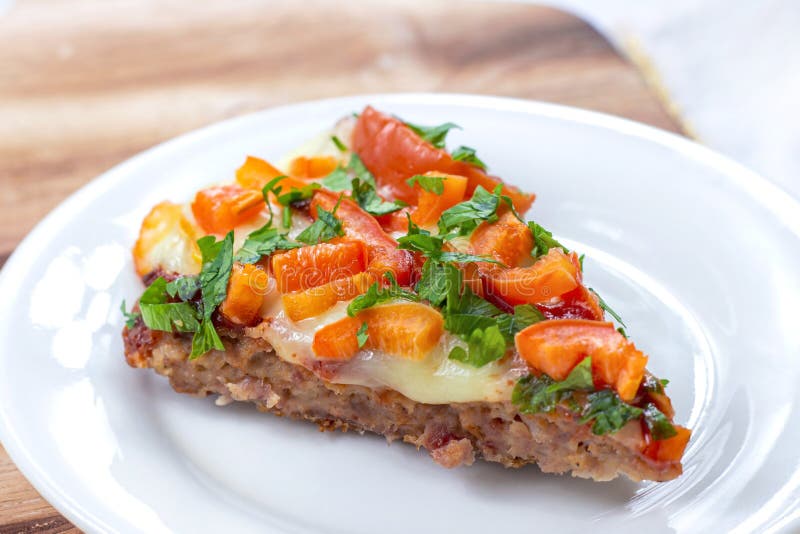 Tasty homemade Low-Carb Keto Meatza (grain and gluten free beef meat-based pizza) slice royalty free stock photography Tasty homemade Low-Carb Keto Meatza (grain and gluten free beef meat-based pizza) slice royalty free stock photography
