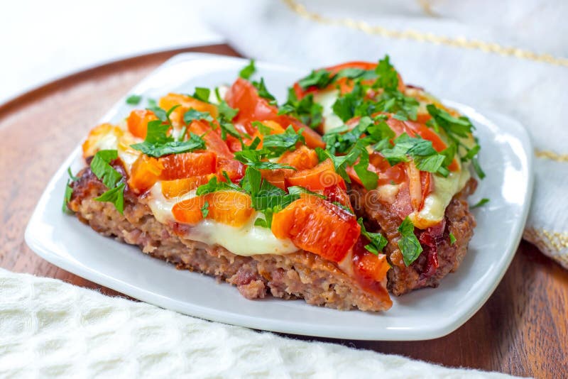 Tasty homemade Low-Carb Keto Meatza (grain and gluten free beef meat-based pizza) slice royalty free stock photos Tasty homemade Low-Carb Keto Meatza (grain and gluten free beef meat-based pizza) slice royalty free stock photos