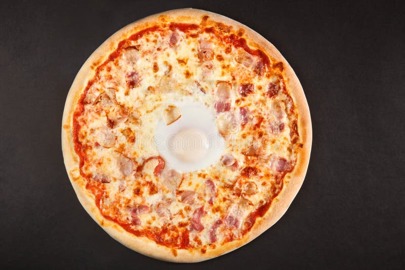 Tasty Italian pizza with bacon egg and sheese royalty free stock images