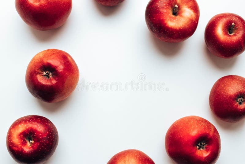 Tasty juicy red rayal gala apples on grey backgroung. Top view. Autumn composition.