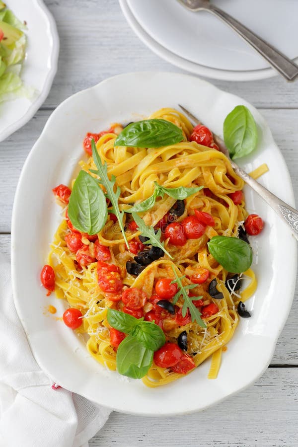 Tasty Pasta with Mussels, Squid, Parsley and Lemon Stock Image - Image