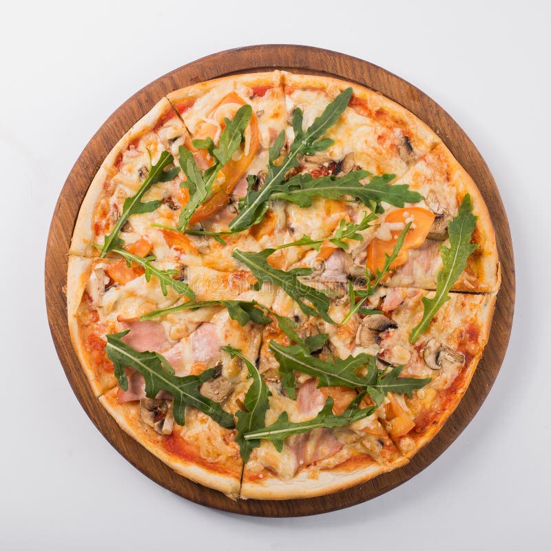 Tasty pizza with tomato, bacon and arugula