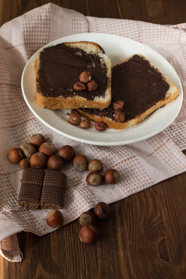 Tasty toast with peanut butter on a plate stock images Tasty toast with peanut butter on a plate stock images