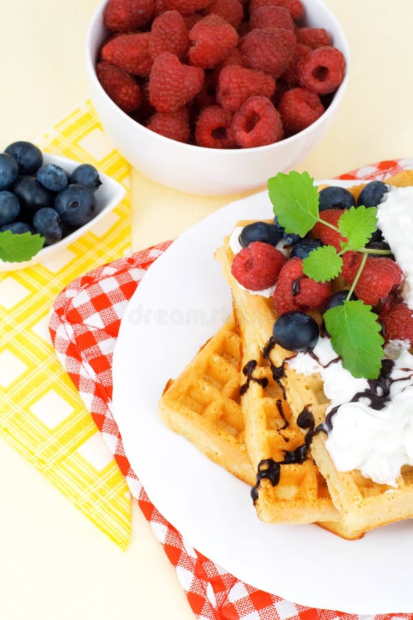 Tasty waffles with summery fruits, whipped cream and chocolate. Ceram stock images, royalty-free photos and pictures