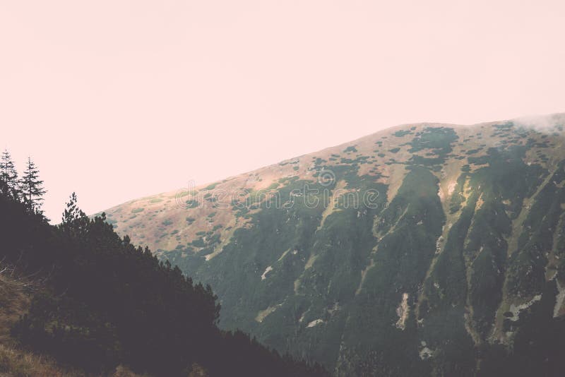 Tatra mountains in Slovakia covered with clouds - vintage effect