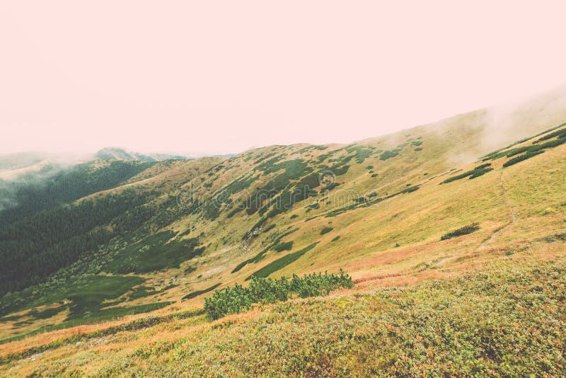 Tatry na Slovensku zahalené mrakmi - vintage efekt