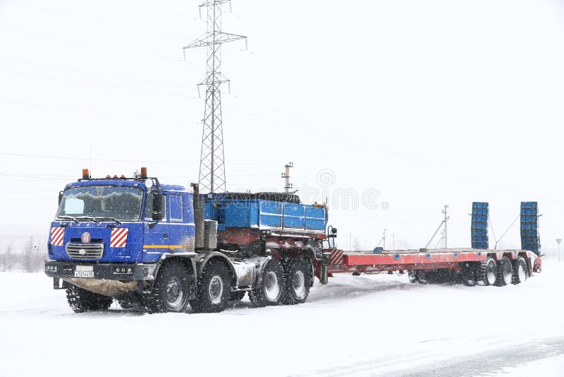 Novyy Urengoy, Russia - April 30, 2018: Offroad semitrailer truck Tatra T815-2 TerrNo1 at a snow covered road. Novyy Urengoy, Russia - April 30, 2018: Offroad semitrailer truck Tatra T815-2 TerrNo1 at a snow covered road