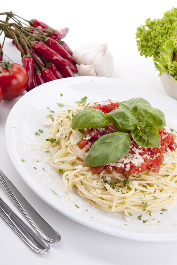 Tatsty fresh spaghetti with tomato sauce and parmesan royalty free stock images