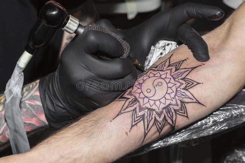 Tattoo in Form of Circular Pattern on Man`s Arm Stock Photo - Image of hand,  machine: 153496448