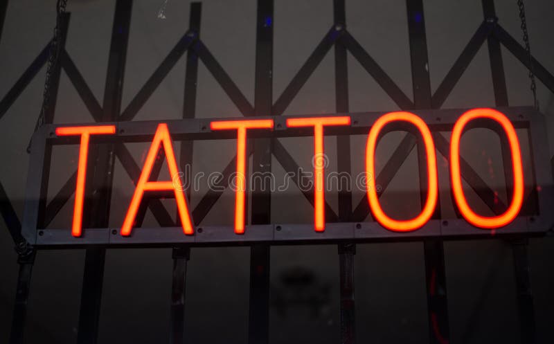 A Tattoo sign in the storefront window of Inkcrafta Tattoo Co on 7223 Owensmouth Ave.