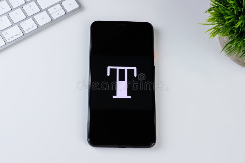 Tattoodo app logo on a smartphone screen. royalty free stock images