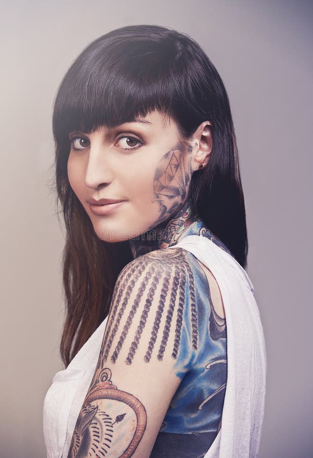 Tattooed Beauty. a Cropped Studio Portrait of a Tattooed Young Woman ...