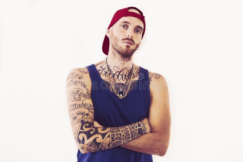 Tattooed rap singer posing in studio