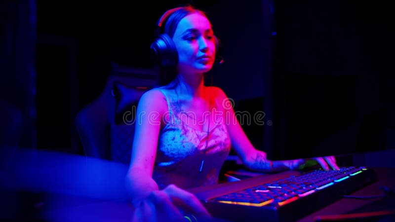 Sexy Young Woman Sitting in Gaming Club and Playing Online Game, People  Stock Footage ft. body & clothes - Envato Elements