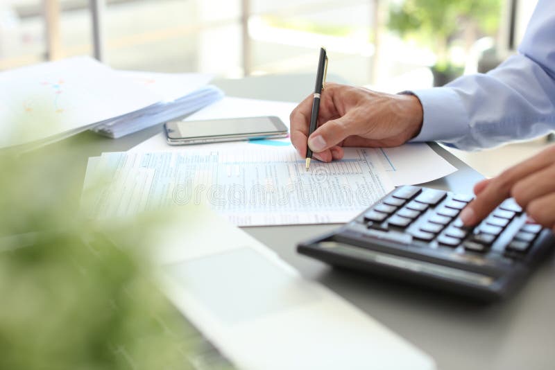 Tax accountant working with documents stock photos