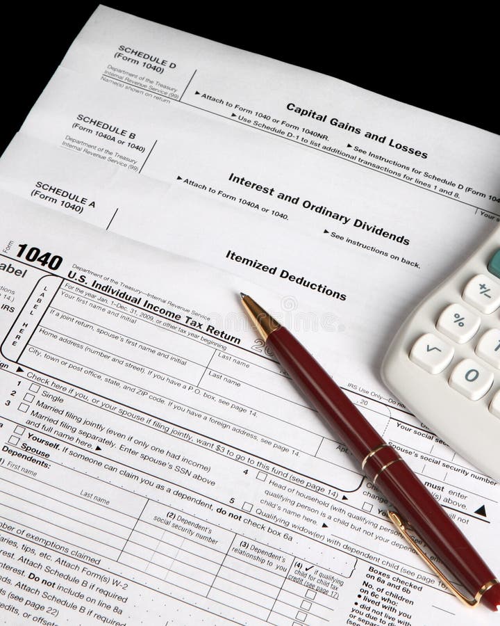 Tax forms with calculator and pen stock image