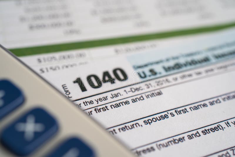 tax-return-form-1040-and-dollar-banknote-u-s-individual-income