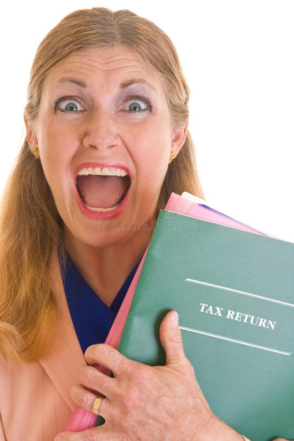 Frightened middle aged woman terrified about completing her annual taxes for the American government of the I.R.S. Frightened middle aged woman terrified about completing her annual taxes for the American government of the I.R.S.