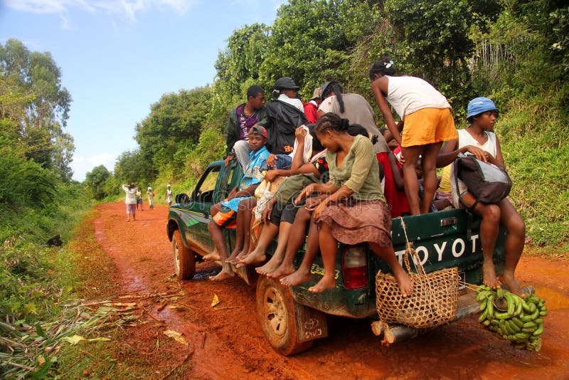 Overcrowded pick up transporting people from small villages to the city Antalaha in the northern part of Madagascar. Overcrowded pick up transporting people from small villages to the city Antalaha in the northern part of Madagascar