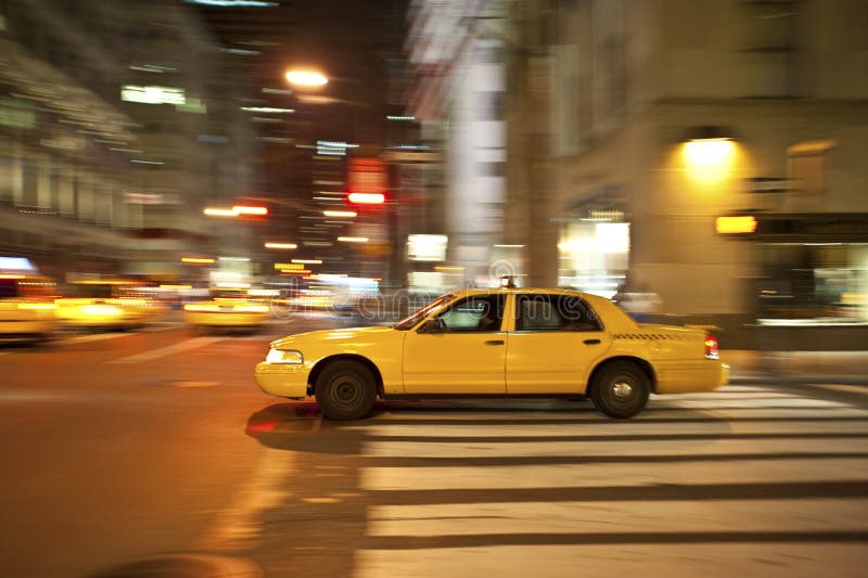 Taxi at night, blurred with motion