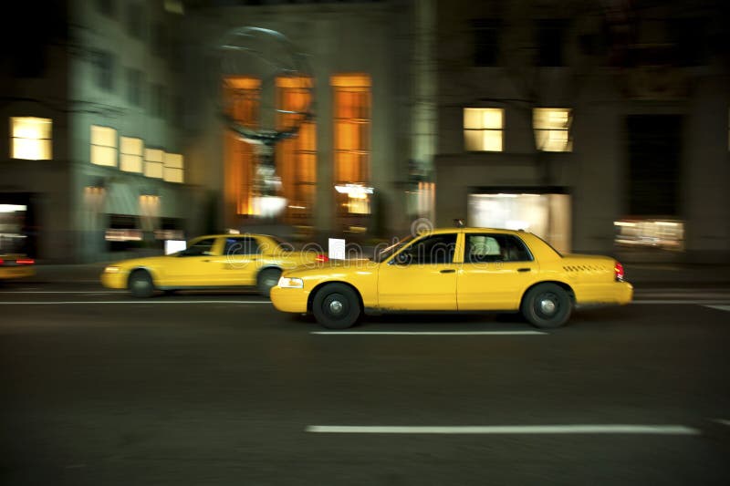 Taxi at night, blurred with motion