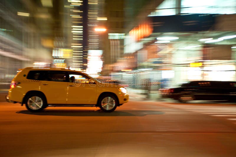 Taxi at night, blurred with motion