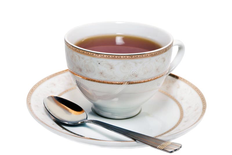 Taza de té en un platillo fotografía de archivo Taza de té en un platillo fotografía de archivo