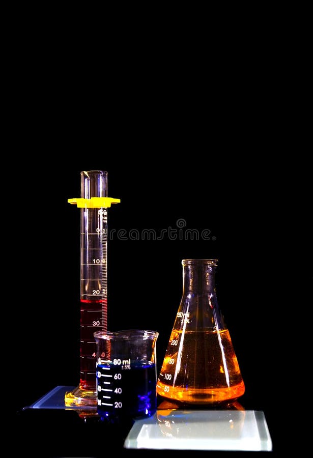 Beakers and a flask against a black background. Beakers and a flask against a black background