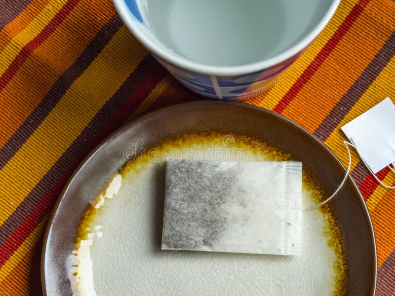 Tea bag in a plate stock photo. Image of plate, breakfast 114625092