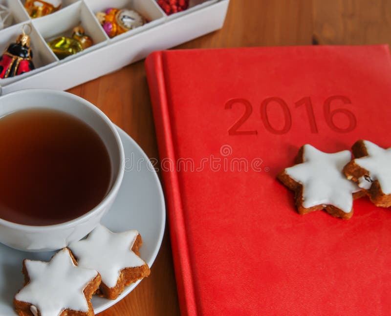 Tea with cake , diary and Christmas decoration