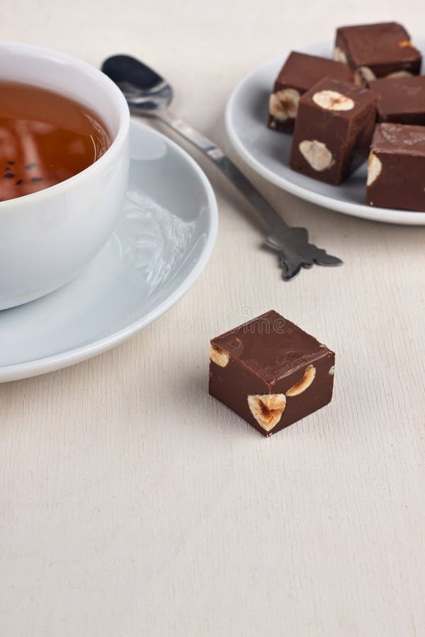 Tea and chocolate stock image. Image of vertical, candy - 27999567