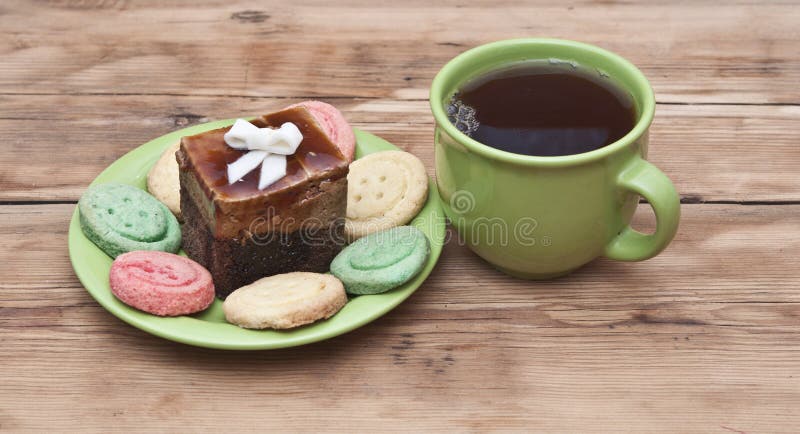 Tea cup with colorful cookies