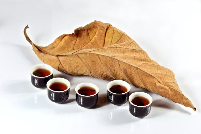 Tea cup with dried leaf