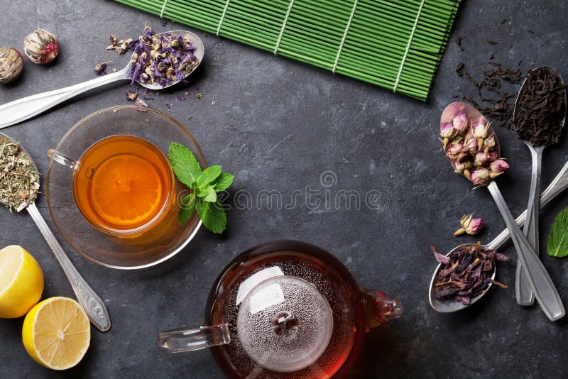 Tea Cup, Teapot and Assortment of Dry Tea in Spoons Stock Photo Image
