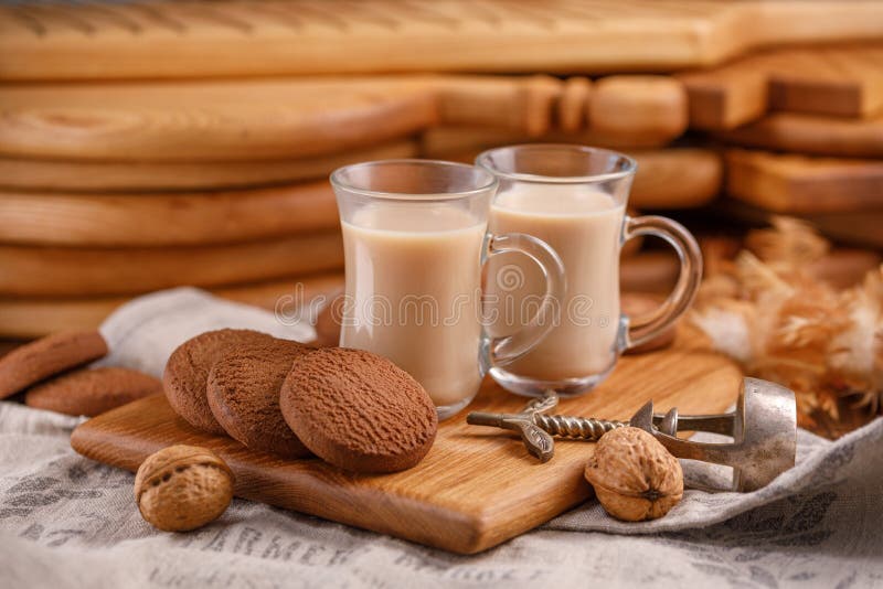 Tea is in English. Delicious and healthy breakfast. Tea with milk and oatmeal cookies.