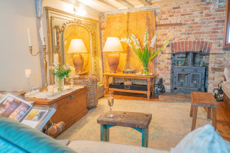 The Tea House Lounge room rustic support and ceiling beams  brick wall and golden hue lighting reflected in mirror Rye United Kingdom