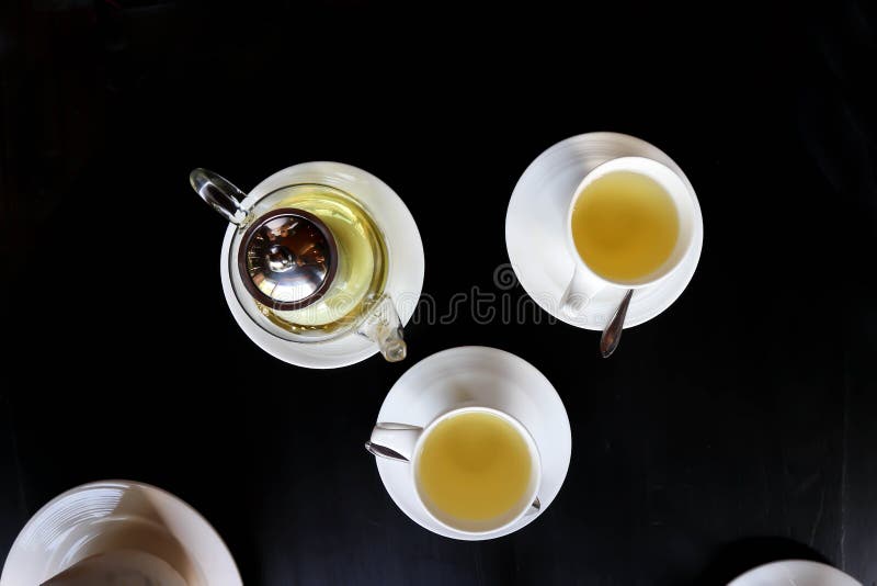 Tea, tea pot and cups on the table stock photography
