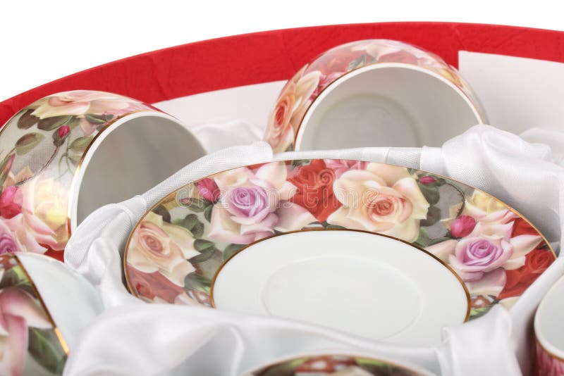 Tea Set in a Red Round Box with White Cloth. Saucers and Tea Cups Stock