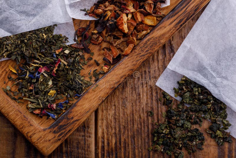 Tea specialized packages for brewing on a wooden board. Tea of different varieties. Tie Guan fruit herbal tea royalty free stock images Tea specialized packages for brewing on a wooden board. Tea of different varieties. Tie Guan fruit herbal tea royalty free stock images