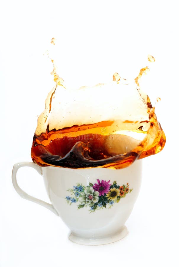Tea splash from a cup on the white background