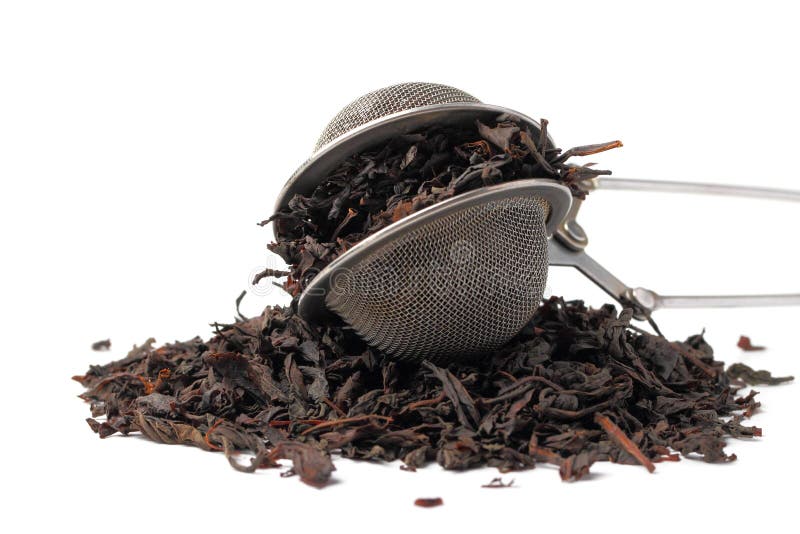 Tea Strainer with Tea Leaves on a White Background Closeup,isolate