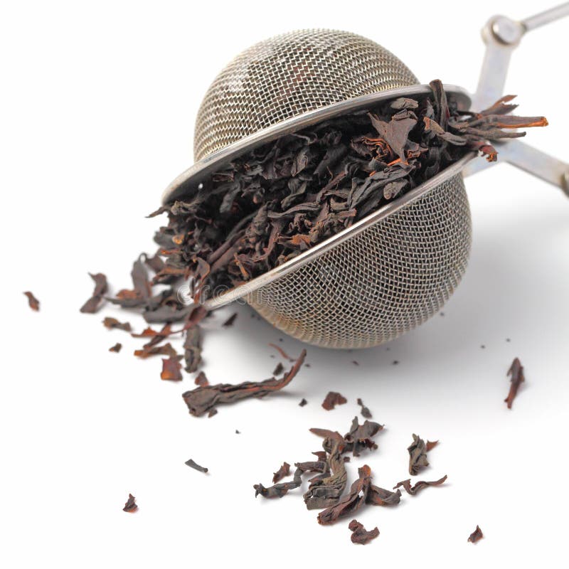 Tea Strainer with Tea Leaves on a White Background Closeup,isolate