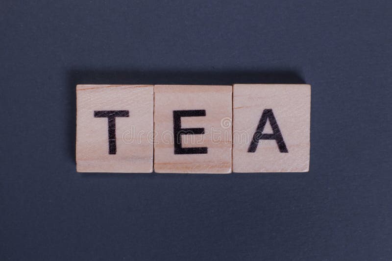 Tea Word from Wooden Letters on a Gray Background Stock Photo Image