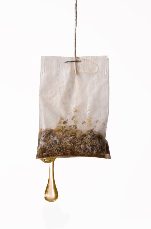 Soaking a tea bag on white background.Drop down hot tea on white background. Soaking a tea bag on white background.Drop down hot tea on white background.